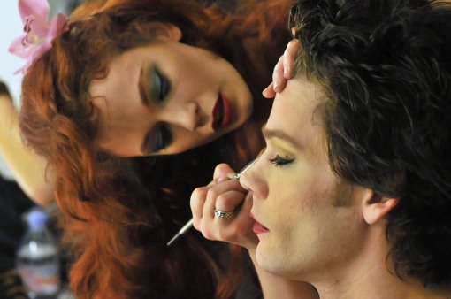 Justine Joli (Caesonia) applies Ryan Knowles ' (Caligula) makeup in the dressing room backstage at CALIGULA MAXIMUS. Photo by J.B. Nicholas / Atlas Press