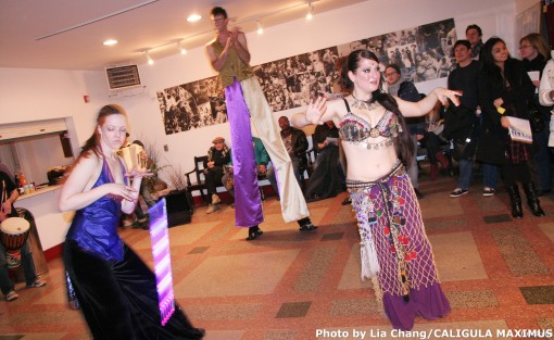 Belly Dancer Sarah Hassan, circus performers and musicians perform in the lobby of the Ellen Stewart Theatre before the performance of CALIGULA MAXIMUS. Photo by Lia Chang
